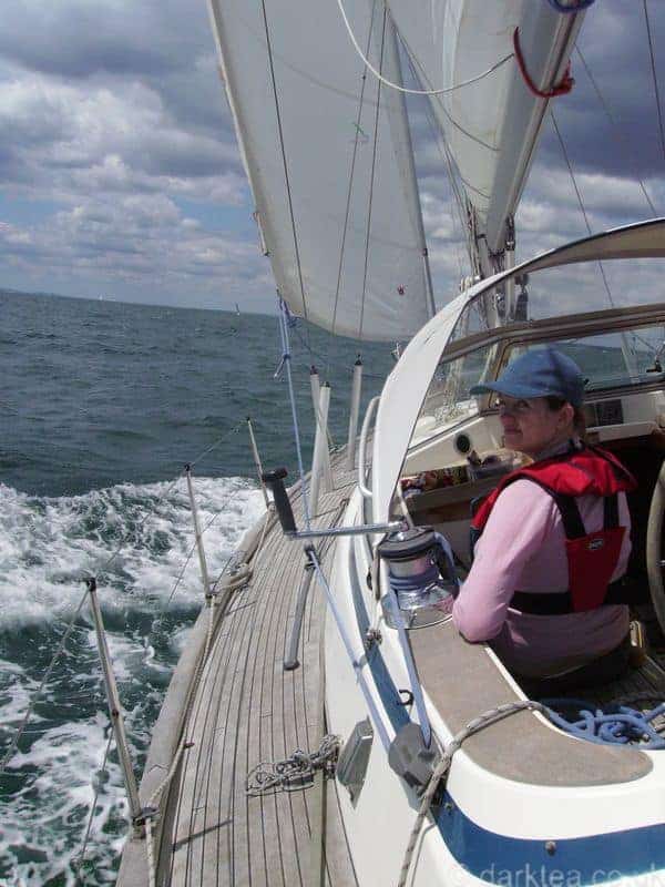 A woman sitting in a sailing boat