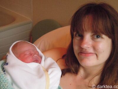 A woman holding a new born baby