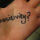 Positivity written on a persons hand