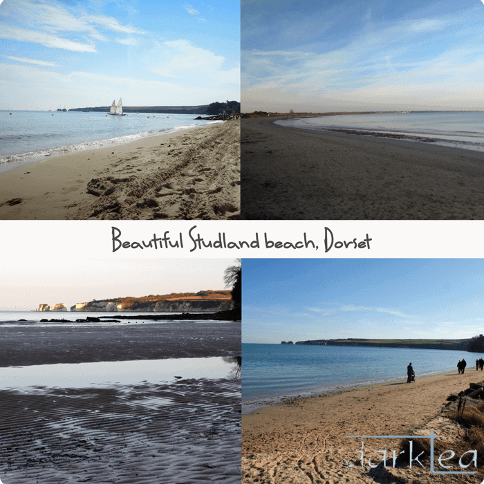 A sandy beach next to a body of water - Studland beach, Dorset