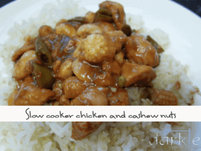 A plate of food with rice meat and vegetables - chicken and cashew nuts made in the slow cooker