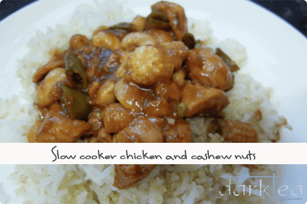 A plate of food with rice meat and vegetables - chicken and cashew nuts made in the slow cooker