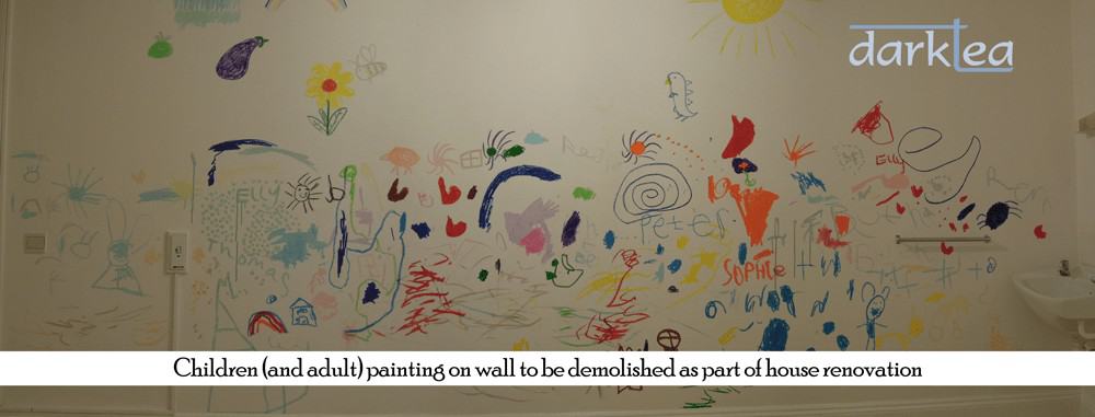 children's drawing on a white wall
