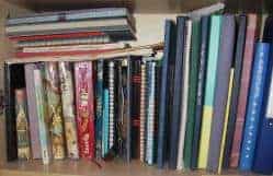 A book shelf filled with journals