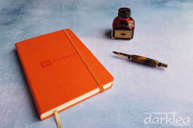 My 2018 journal is an orange castelli notebook and I write in red Diamine ink