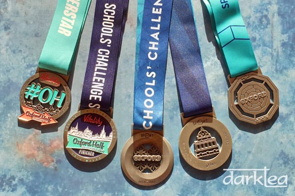 5 medals from the Oxford Half Marathon Schools' Challenge