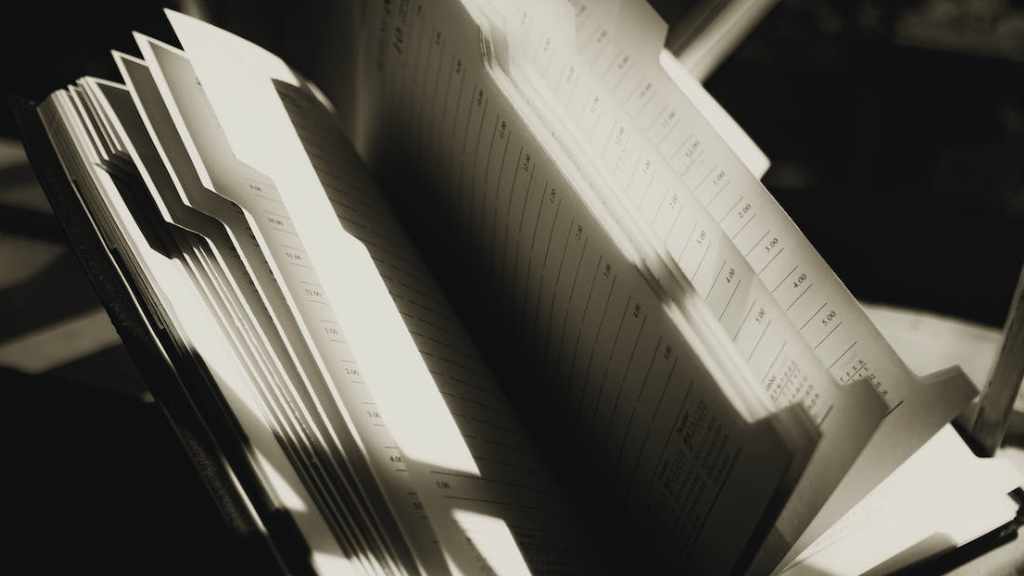 A black and white photo of an open book for daily journaling.